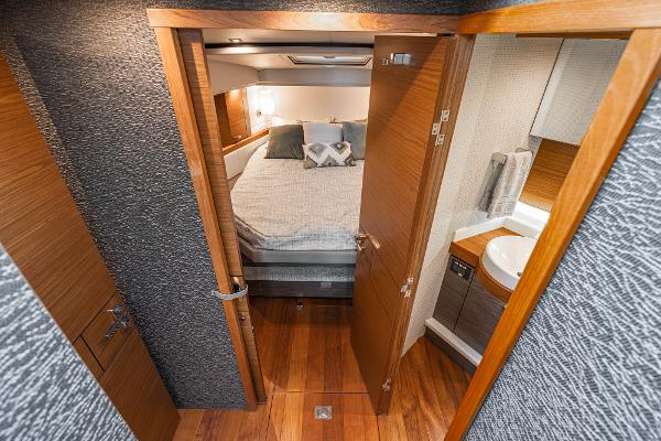 Slide: The Image of 2020 Tiara Yachts 39 Coupe interior with cozy bedroom and modern bathroom. - 26