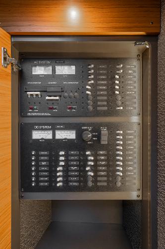Slide: The Image of Electrical control panel inside 2020 Tiara Yachts 39 Coupe, featuring various switches and indicators. - 28
