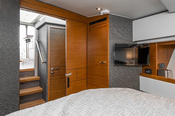 Slide: The Image of Luxurious interior of 2020 Tiara Yachts 39 Coupe with modern wood finishes and TV. - 32