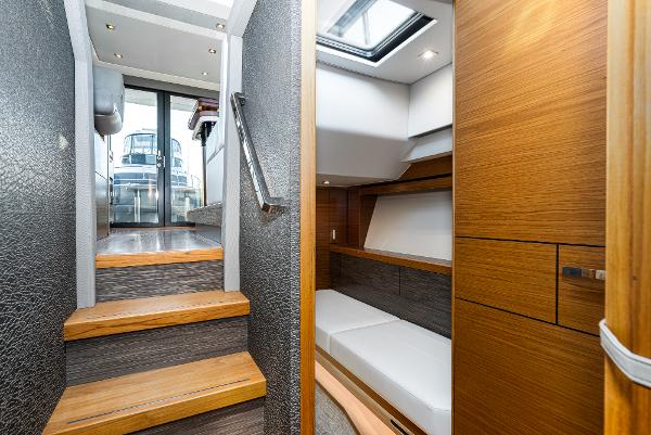 Slide: The Image of Interior of 2020 Tiara Yachts 39 Coupe, featuring modern wood finishes and sleek design. - 37