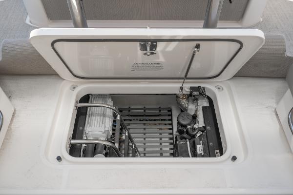Slide: The Image of Engine compartment of 2020 Tiara Yachts 39 Coupe, showcasing mechanical components and storage. - 42