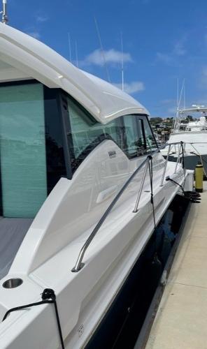 Slide: The Image of 2020 Tiara Yachts 39 Coupe docked, showcasing sleek design and modern features. - 6