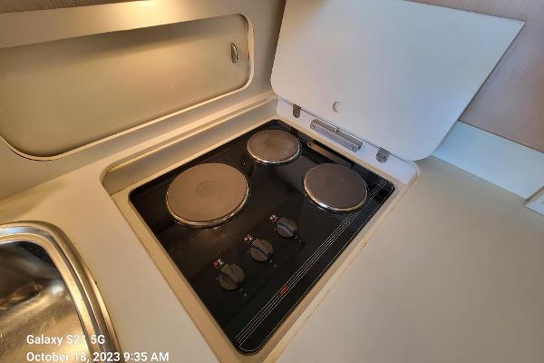 Slide: The Image of Galley  - Three  Burner Stove Top - 21