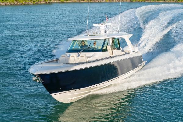 Slide: The Image of 2025 Tiara Yachts 48 LS cruising on open water. - 0