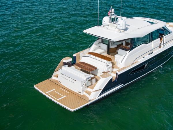 Slide: The Image of 2025 Tiara Yachts EX 60 luxury yacht on open water, rear view. - 13