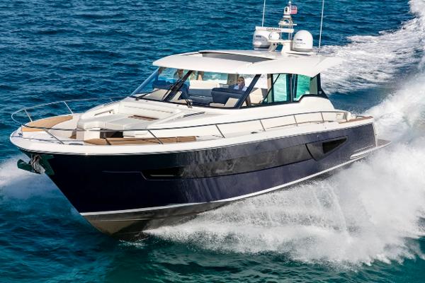 Slide: The Image of 2025 Tiara Yachts EX 60 cruising on open water, showcasing sleek design and luxury. - 3