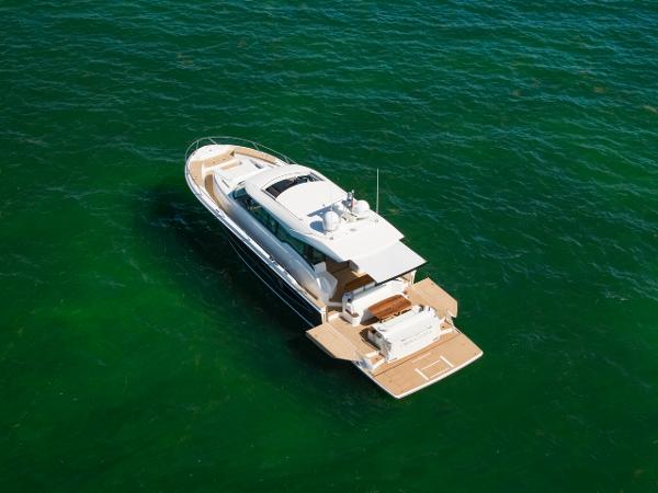 Slide: The Image of 2025 Tiara Yachts EX 60 luxury yacht on open water. - 9