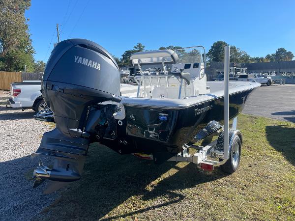 Slide: The Image of 2024 Tidewater 1910 Bay Max boat with Yamaha engine on trailer, parked outdoors. - 3