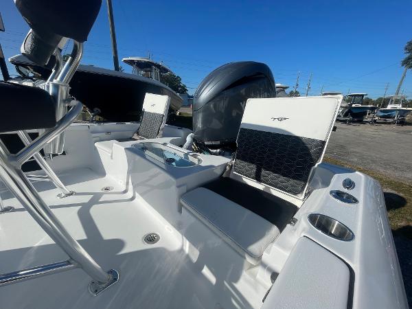 Slide: The Image of 2024 Tidewater 1910 Bay Max boat interior with seating and motor, showcasing modern design. - 6