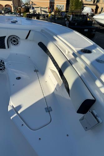 Slide: The Image of 2024 Tidewater 256 LXF boat interior with seating and storage compartments. - 10