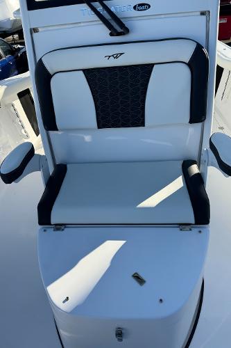 Slide: The Image of 2024 Tidewater 256 LXF boat seat with black and white upholstery. - 13