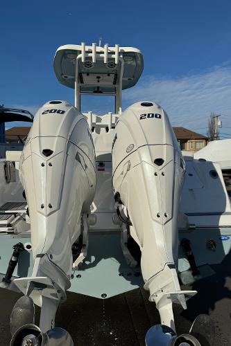 Slide: The Image of 2024 Tidewater 256 LXF boat with twin 200 horsepower engines. - 15