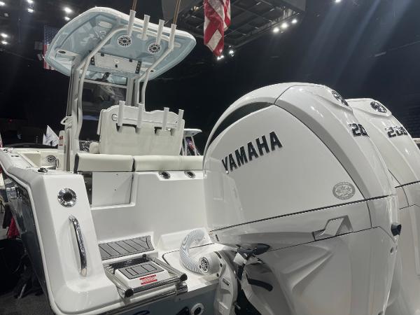 Slide: The Image of 2024 Tidewater 256 LXF boat with dual Yamaha engines on display. - 21