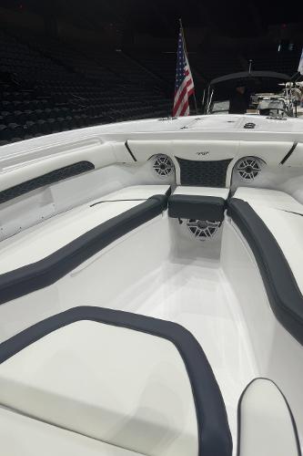 Slide: The Image of 2024 Tidewater 256 LXF boat interior with seating and American flag. - 24