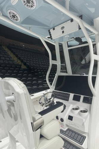 Slide: The Image of 2024 Tidewater 256 LXF boat interior with advanced navigation system and comfortable seating. - 25