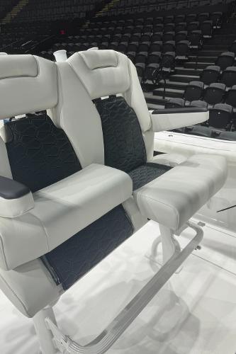 Slide: The Image of 2024 Tidewater 256 LXF boat seating with black and white upholstery. - 27
