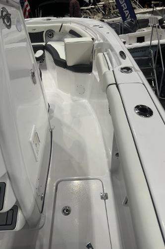 Slide: The Image of 2024 Tidewater 256 LXF boat interior with seating and storage compartments. - 28