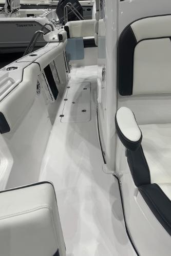 Slide: The Image of 2024 Tidewater 256 LXF boat interior with white and black seating. - 30