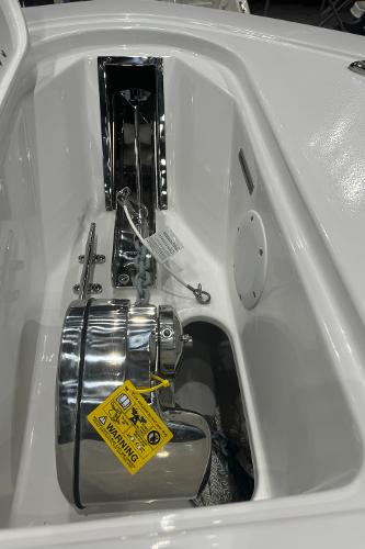 Slide: The Image of 2024 Tidewater 256 LXF boat anchor compartment with chrome hardware. - 35