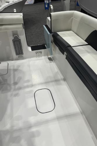 Slide: The Image of 2024 Tidewater 256 LXF boat interior with white and black seating. - 36