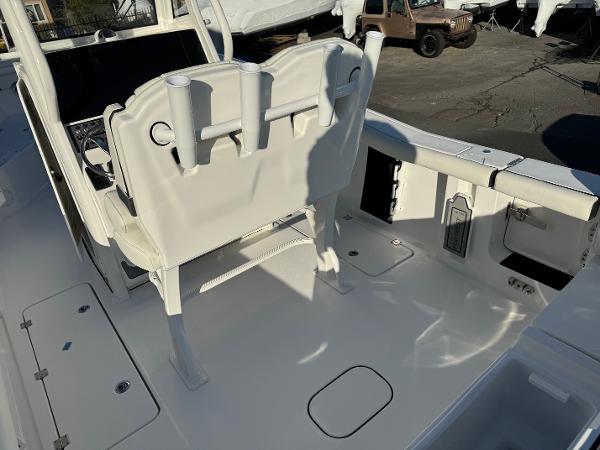 Slide: The Image of 2024 Tidewater 256 LXF boat interior with seating and storage compartments. - 4