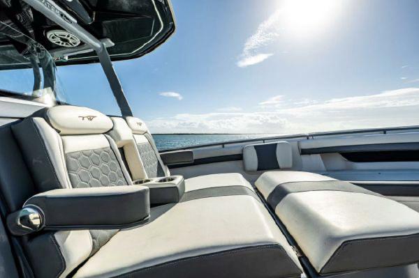 Slide: The Image of 2020 Tidewater 320 CC Adventure boat interior with luxurious seating and ocean view. - 9