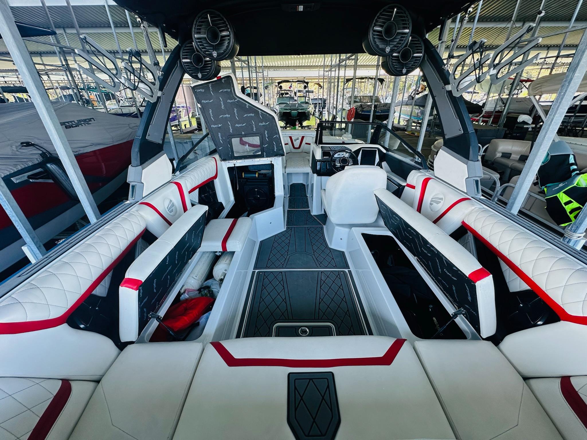 Slide: The Image of 2020 Tigé 25ZX boat interior with luxurious seating and modern design. - 21