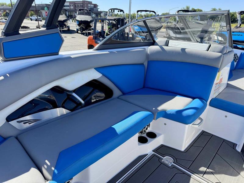 Slide: The Image of 2019 Tigé R21 boat interior with blue and gray seating, showcasing modern design and comfort. - 13