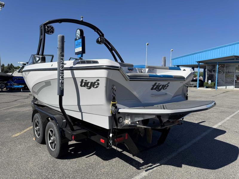Slide: The Image of 2019 Tigé R21 boat on trailer in parking lot, sunny day. - 8