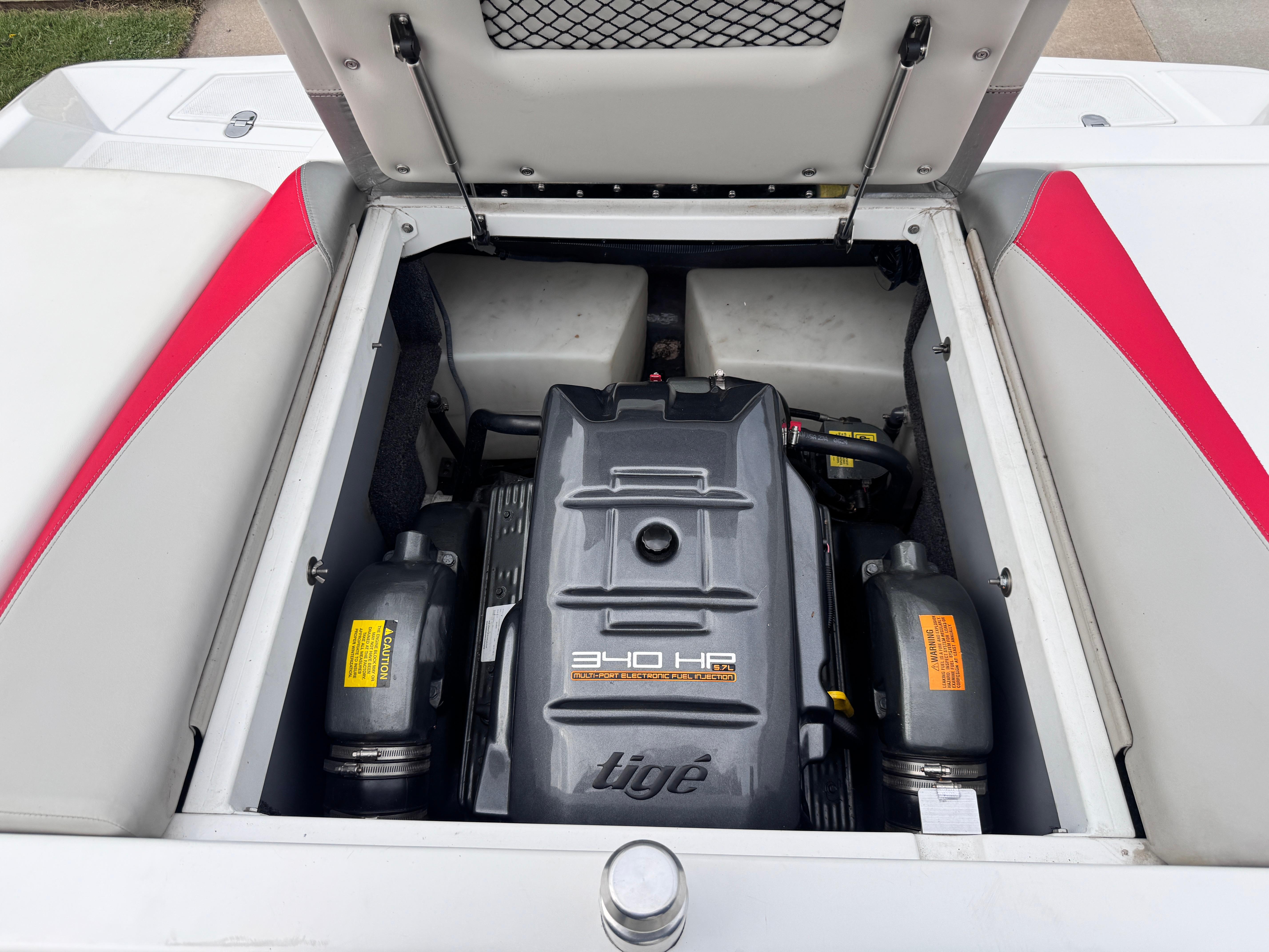 Slide: The Image of 2007 Tigé RZ2 boat engine compartment with 340 HP engine, open hatch. - 11