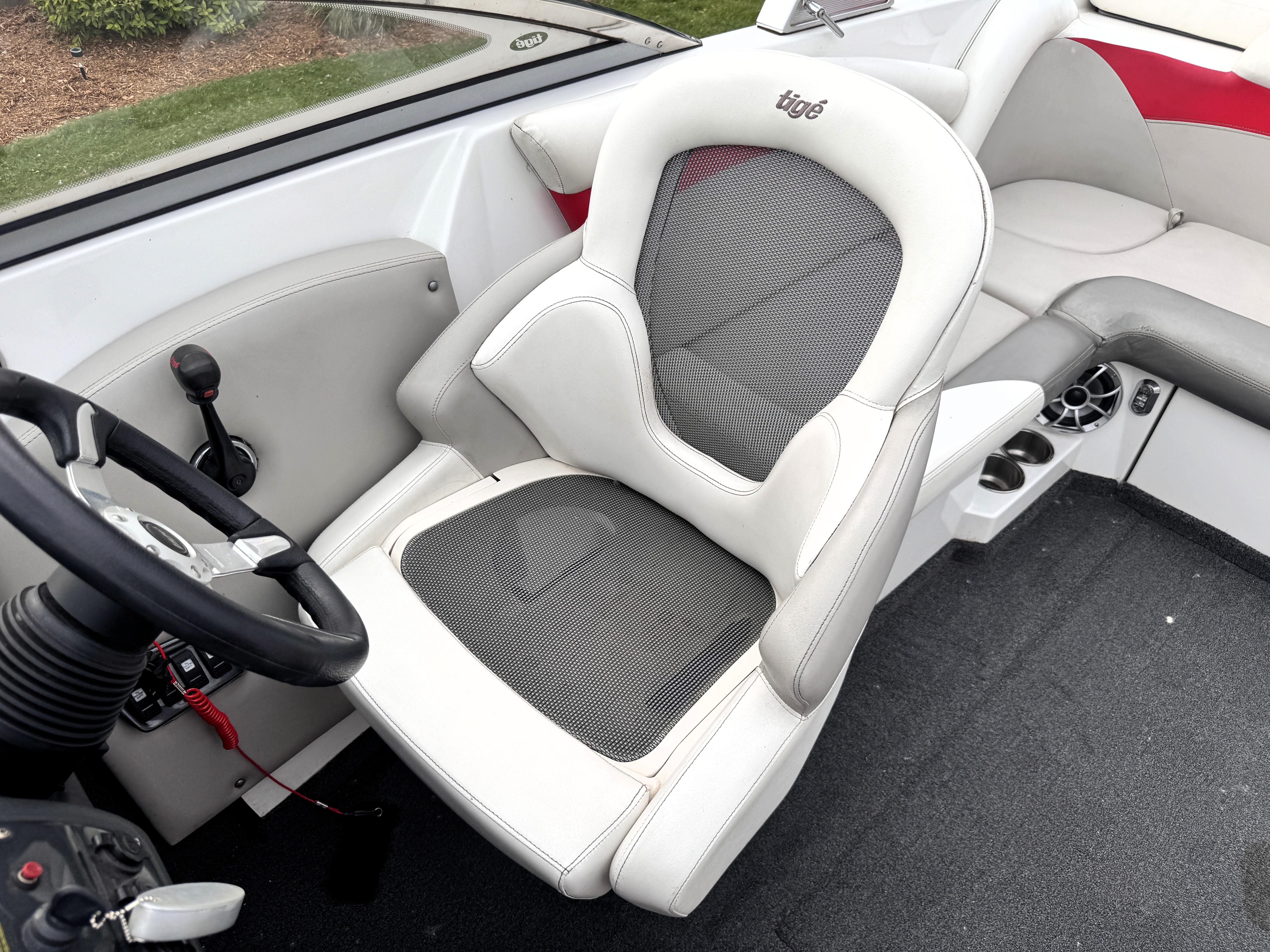 Slide: The Image of 2007 Tigé RZ2 boat interior with steering wheel and captain's seat. - 22