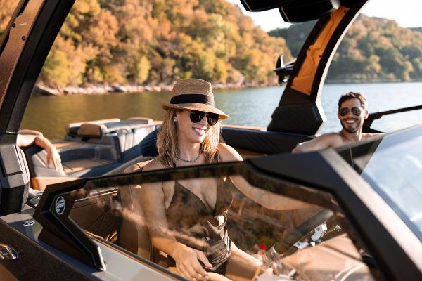Slide: The Image of 2024 Tigé ULTRA ZX 23 and 25 boat with happy passengers on a scenic lake. - 27