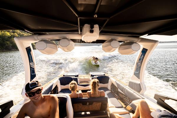 Slide: The Image of 2024 Tigé ULTRA ZX 23 and 25 boat with people wake surfing. - 42