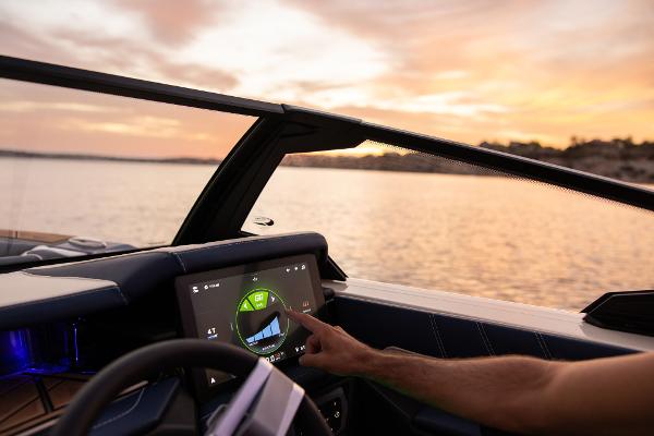 Slide: The Image of 2024 Tigé ULTRA ZX 23 and 25 boat dashboard with touchscreen at sunset. - 47