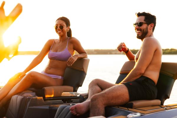 Slide: The Image of Couple enjoying sunset on 2024 Tigé ULTRA ZX 23 and 25 boat. - 6