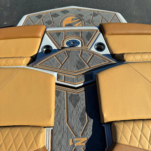 Slide: The Image of 2024 Tigé Z1 boat interior with tan seats and geometric design. - 16