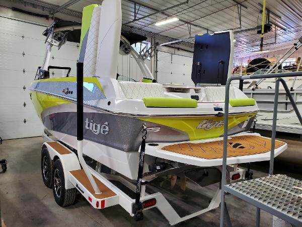 Slide: The Image of 2021 Tigé Z3 boat in a garage, featuring vibrant green and gray accents. - 5