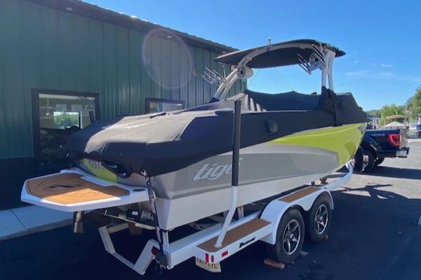Slide: The Image of 2021 Tigé Z3 boat on trailer, covered, parked outdoors. - 6