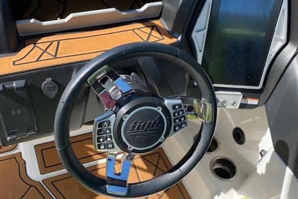 Slide: The Image of 2021 Tigé Z3 boat steering wheel and dashboard with touchscreen display. - 8