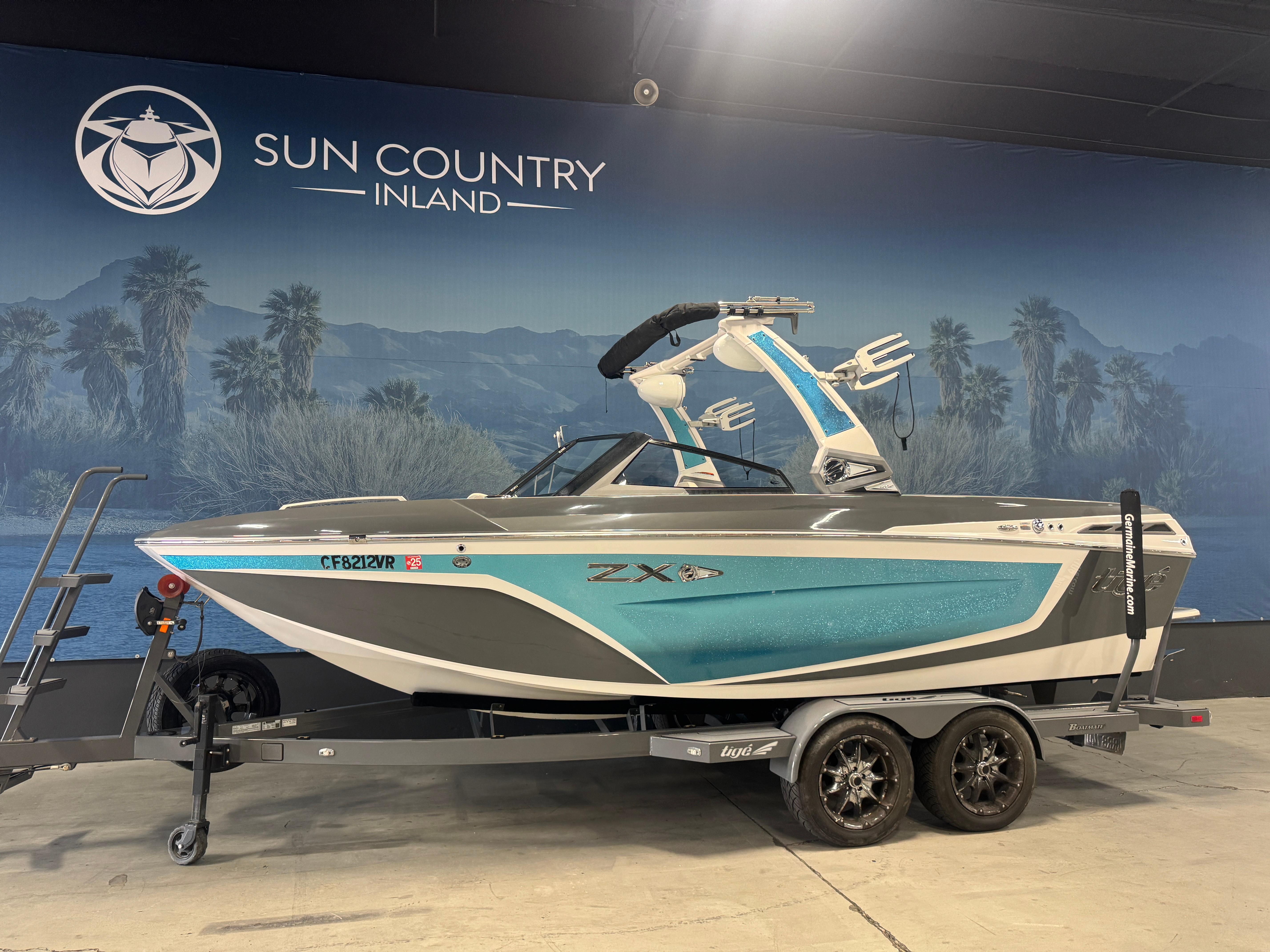 Slide: The Image of 2019 Tigé ZX1 boat on trailer at Sun Country Inland showroom. - 1