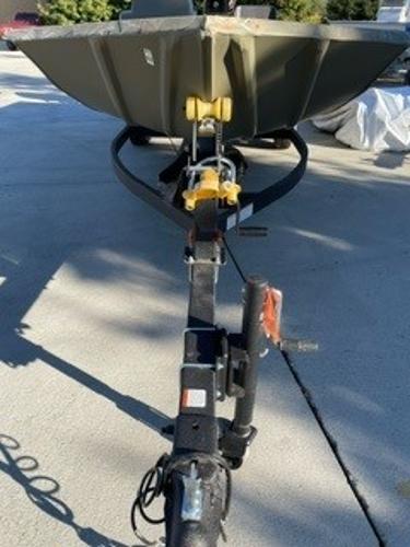 Slide: The Image of 2024 Tracker Grizzly 1754 SC boat on trailer, parked outdoors. - 6