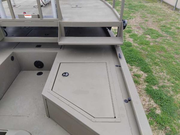 Slide: The Image of 2024 Tracker Grizzly 2072 CC Sportsman boat deck with storage compartment. - 9