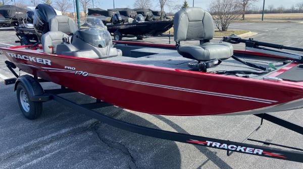 Slide: The Image of 2024 Tracker Pro 170 boat in red on a trailer. - 1