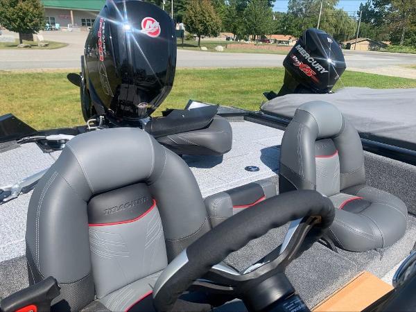 Slide: The Image of 2024 Tracker PT 195 XTE boat interior with Mercury outboard motor. - 6
