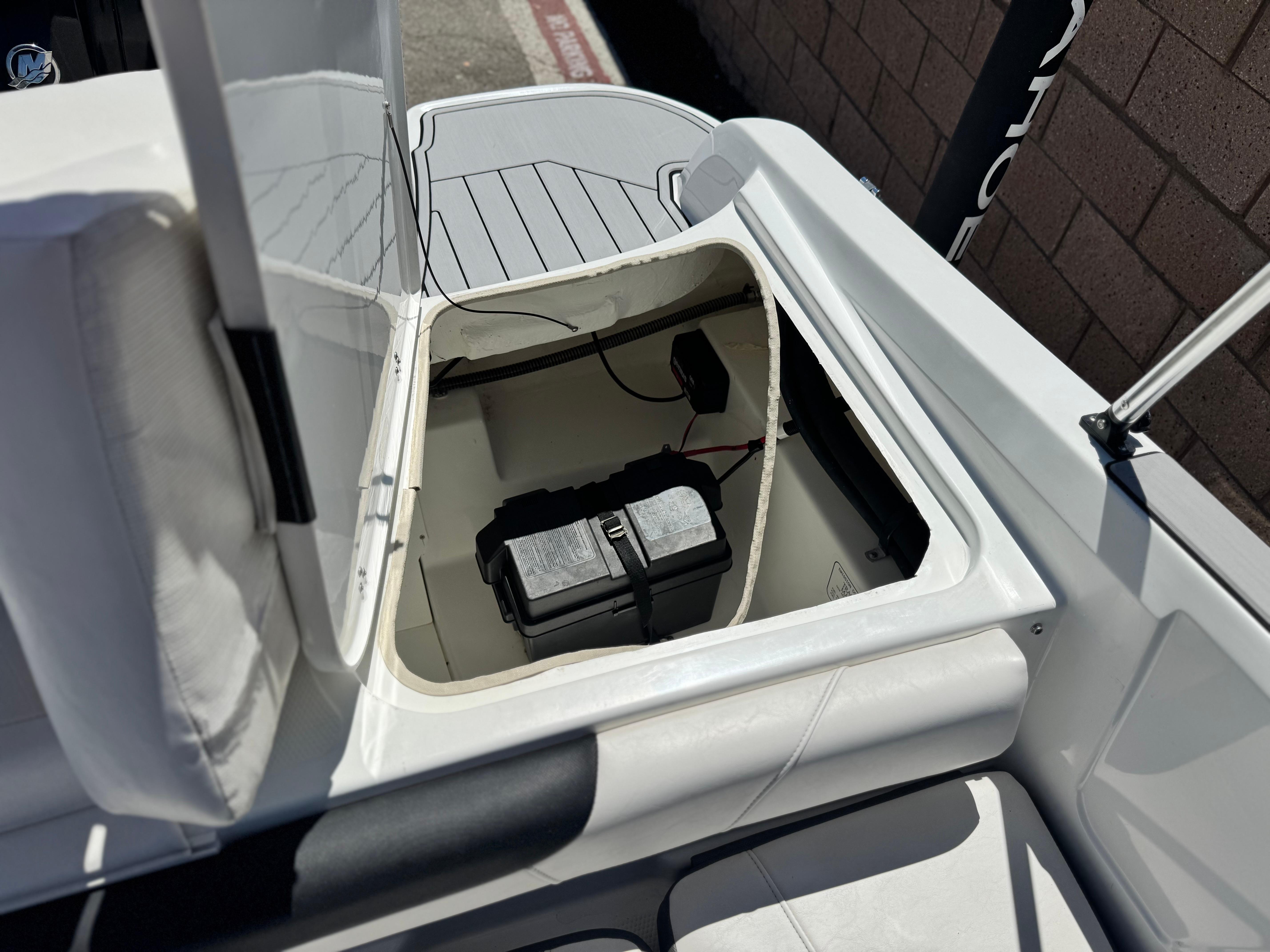 Slide: The Image of 2019 Tracker Tahoe 450 TF boat battery compartment with open hatch. - 14