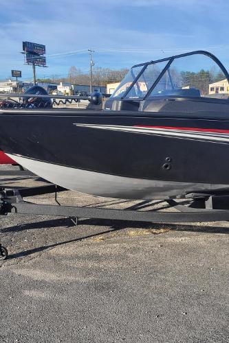 Slide: The Image of 2024 Tracker Targa V-19 WT boat on a trailer in a parking lot. - 1