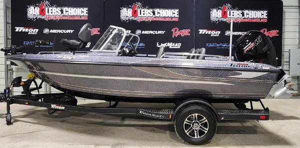 Slide: The Image of 2024 Triton 186 Allure fishing boat on display with trailer. - 0