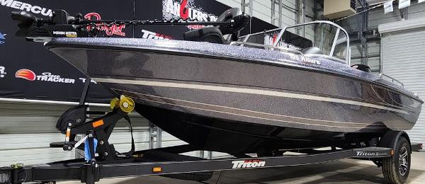 Slide: The Image of 2024 Triton 186 Allure boat on trailer in showroom. - 10