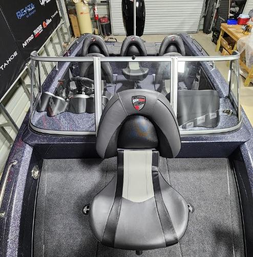 Slide: The Image of 2024 Triton 186 Allure boat interior with seating and steering console. - 12