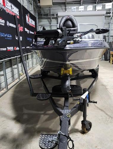 Slide: The Image of 2024 Triton 186 Allure fishing boat on trailer in a garage. - 4